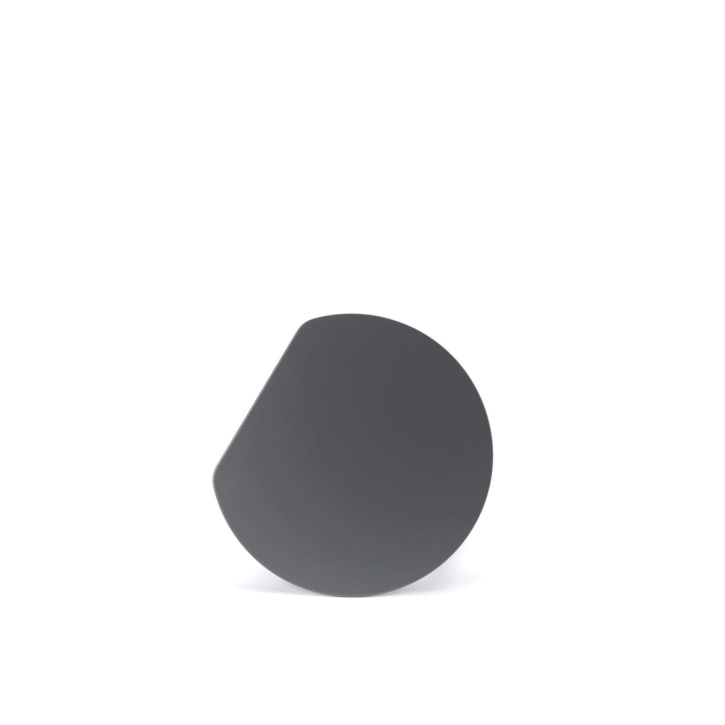 The YYY Coffee Table by TON is a modern minimalist piece with a circular black top featuring a cut-out section, set against a white background. It elegantly blends function and style, highlighted by subtle natural oak accents.