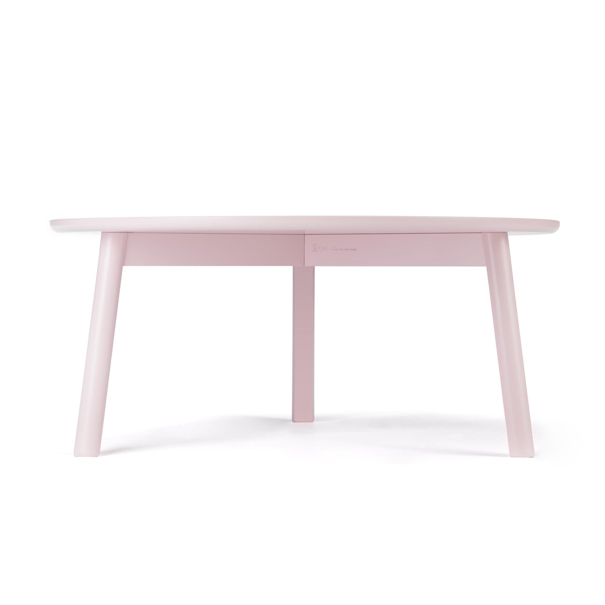 The YYY Coffee Table by TON features a minimalist pink design with four angled legs, exuding modern charm. Its smooth tabletop sits gracefully on a natural oak frame, casting subtle shadows on the pristine white background.