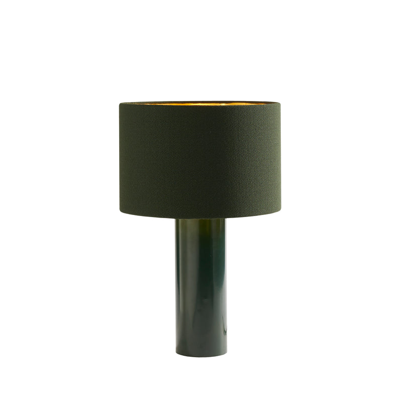 The ALL ROUND Table Lamp by Victor Foxtrot features a cylindrical, powder-coated steel base with a glossy green finish and a matching textured wool fabric lampshade, elegantly highlighted against a plain white background for a sophisticated and stylish look.