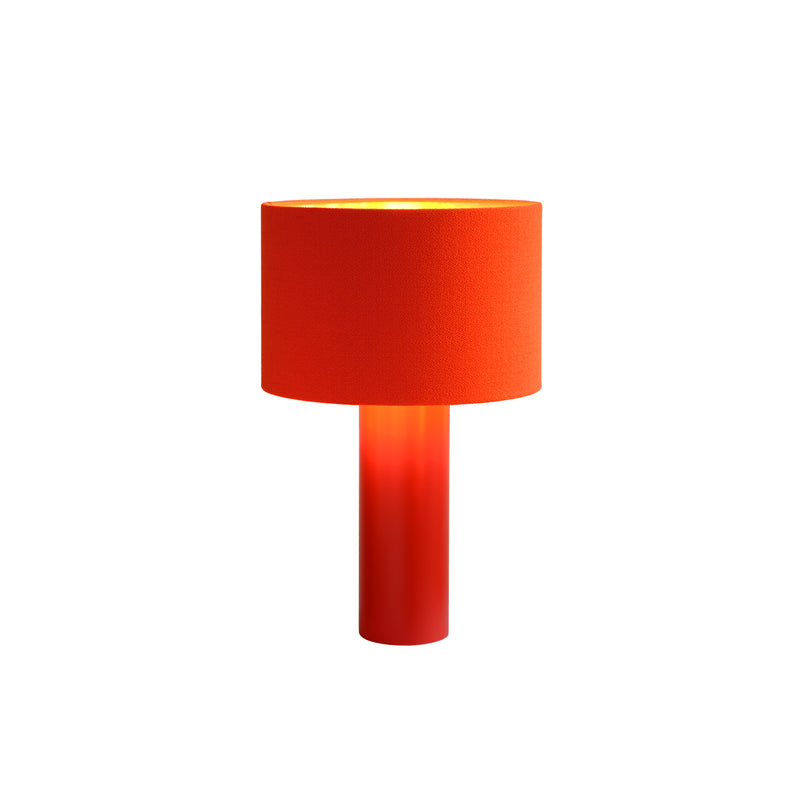 The ALL ROUND Table Lamp by Victor Foxtrot features a vibrant orange wool fabric lampshade and a powder-coated steel base, brightly illuminated against a plain white background.