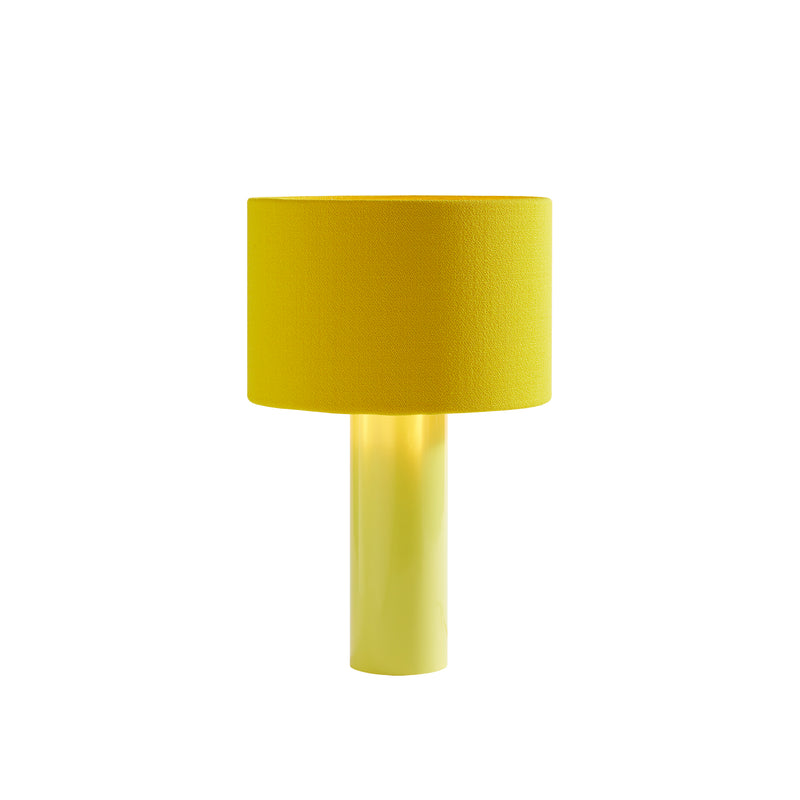 The ALL ROUND Table Lamp by Victor Foxtrot features a vibrant yellow wool fabric shade and a sleek powder-coated steel base. It emits a soft, warm glow, creating an inviting ambiance. Shown on a white background.