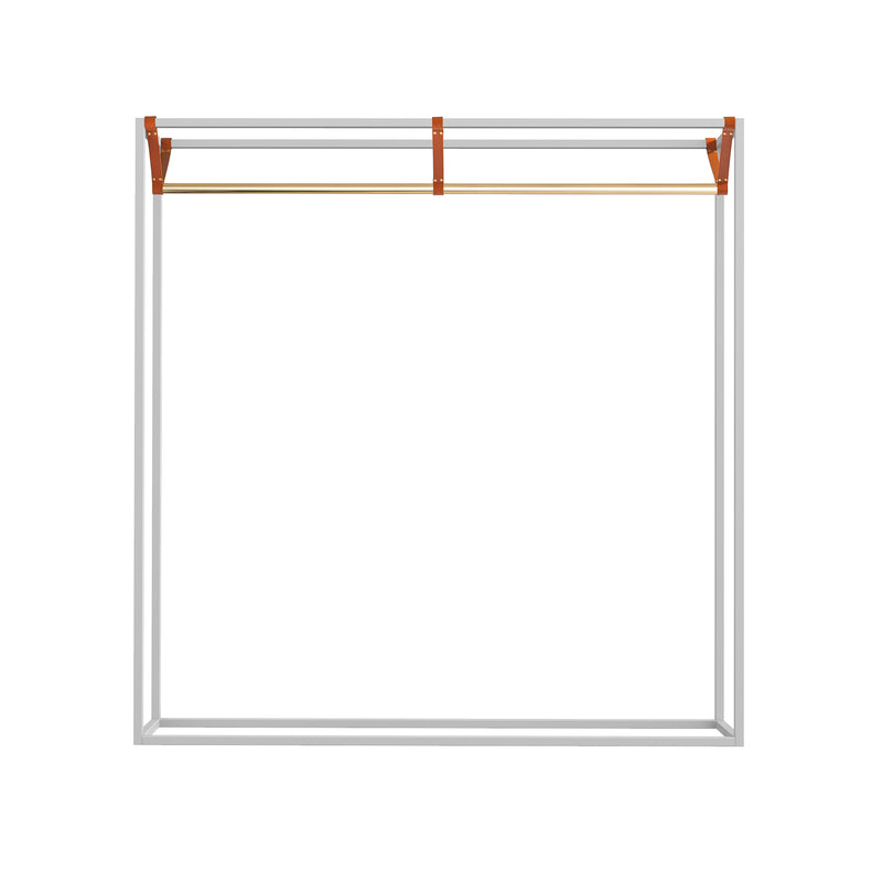 The LESS MESS Coat Stand by Victor Foxtrot features a minimalist design with vegetable-tanned leather straps, a polished brass rod, and an elegant white square frame.