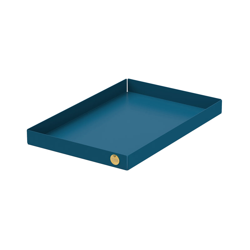 The Victor Foxtrot POI Tray L, made from powder-coated steel, features high sides and a rectangular design. A small gold circular label in one corner complements the crisp white background.