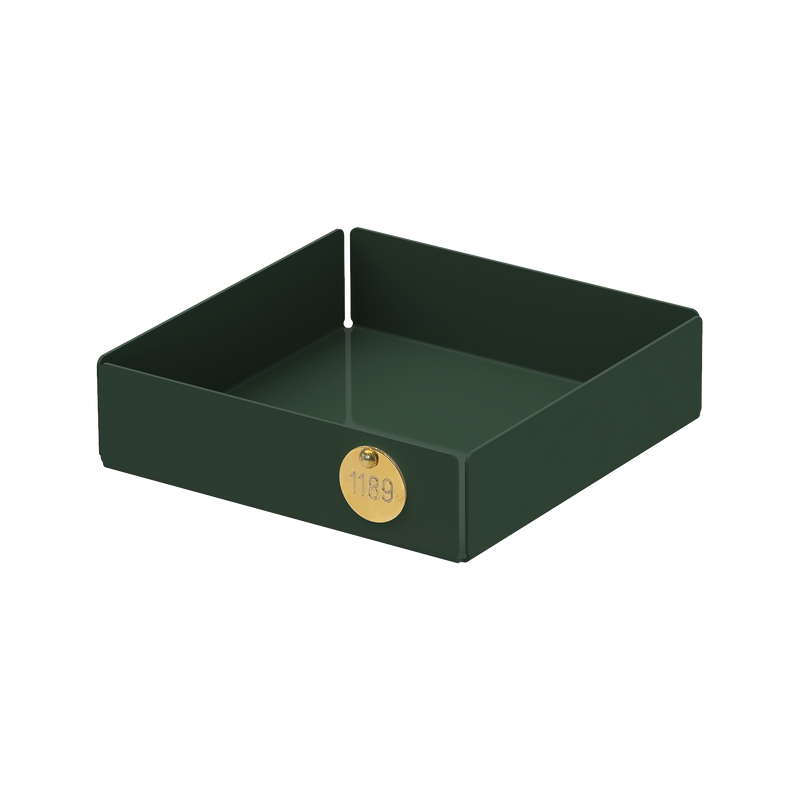 The POI Tray S by Victor Foxtrot is a dark green, square metal tray made from powder-coated steel, featuring a gold 1189 emblem. Its an elegant piece for design lovers.