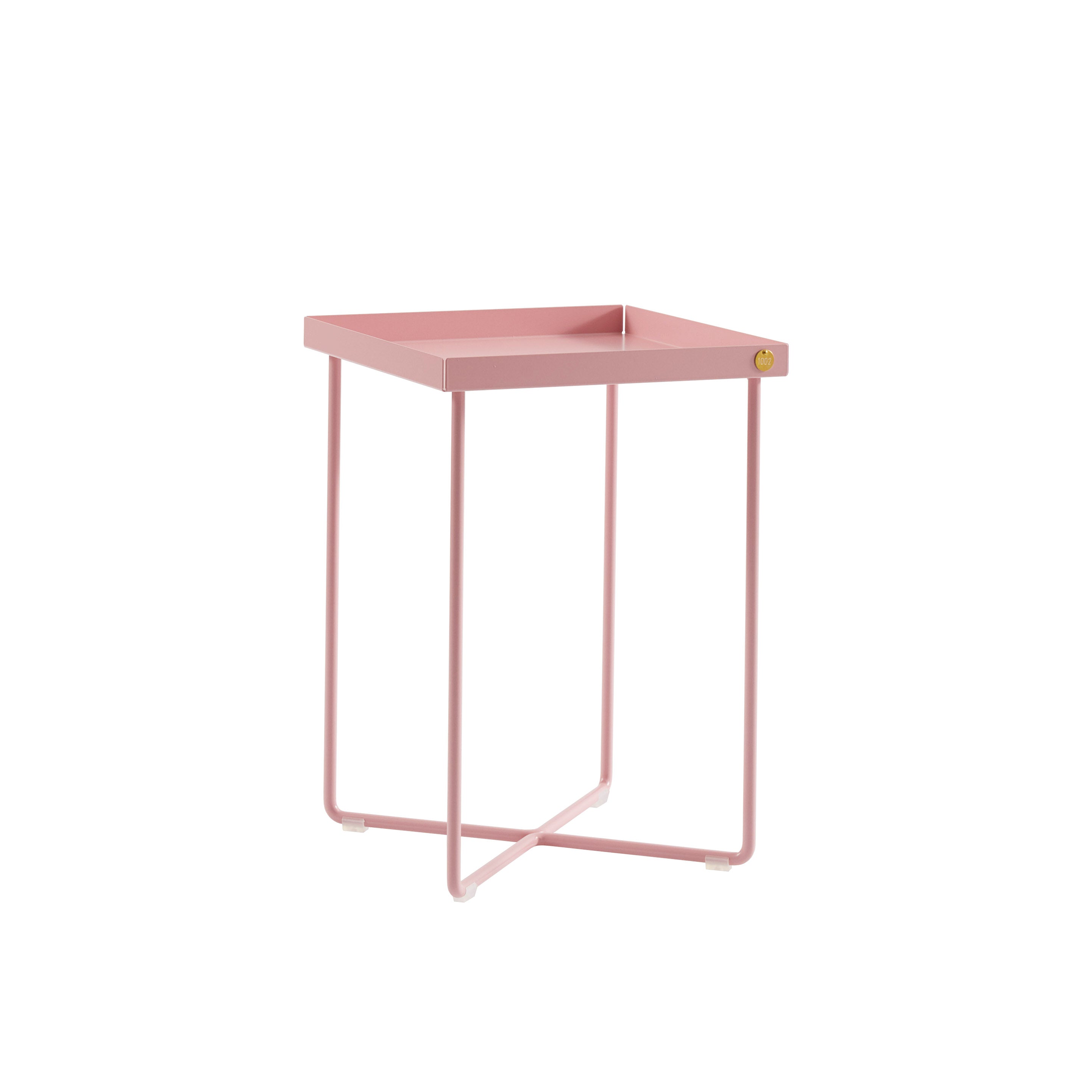 The POI MINI Side Table by Victor Foxtrot showcases a pink metal frame and tabletop, with legs bent in a modern geometric design, making it a sleek and minimalist bedside companion.
