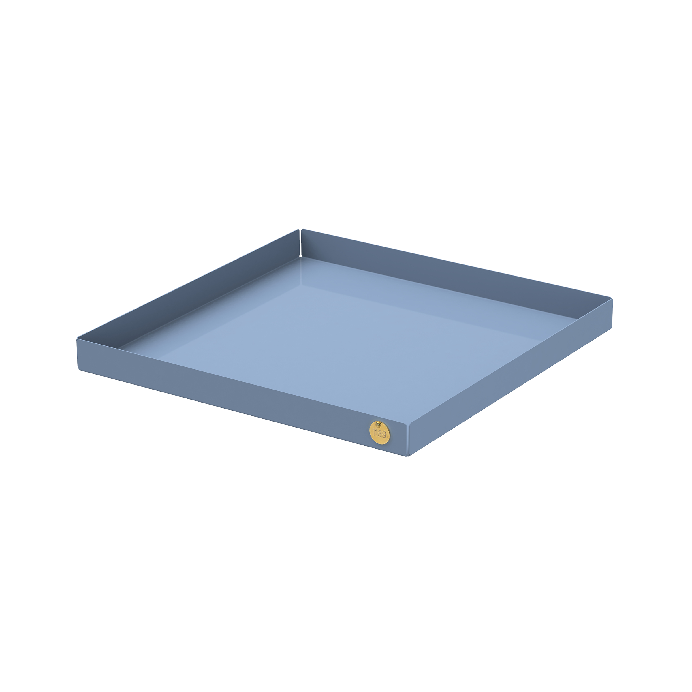 The POI Tray XL by Victor Foxtrot is a square, light blue metal tray made from powder-coated steel. It features a small round gold sticker on the front edge and subtly raised edges, appealing to design lovers against a pristine white background.
