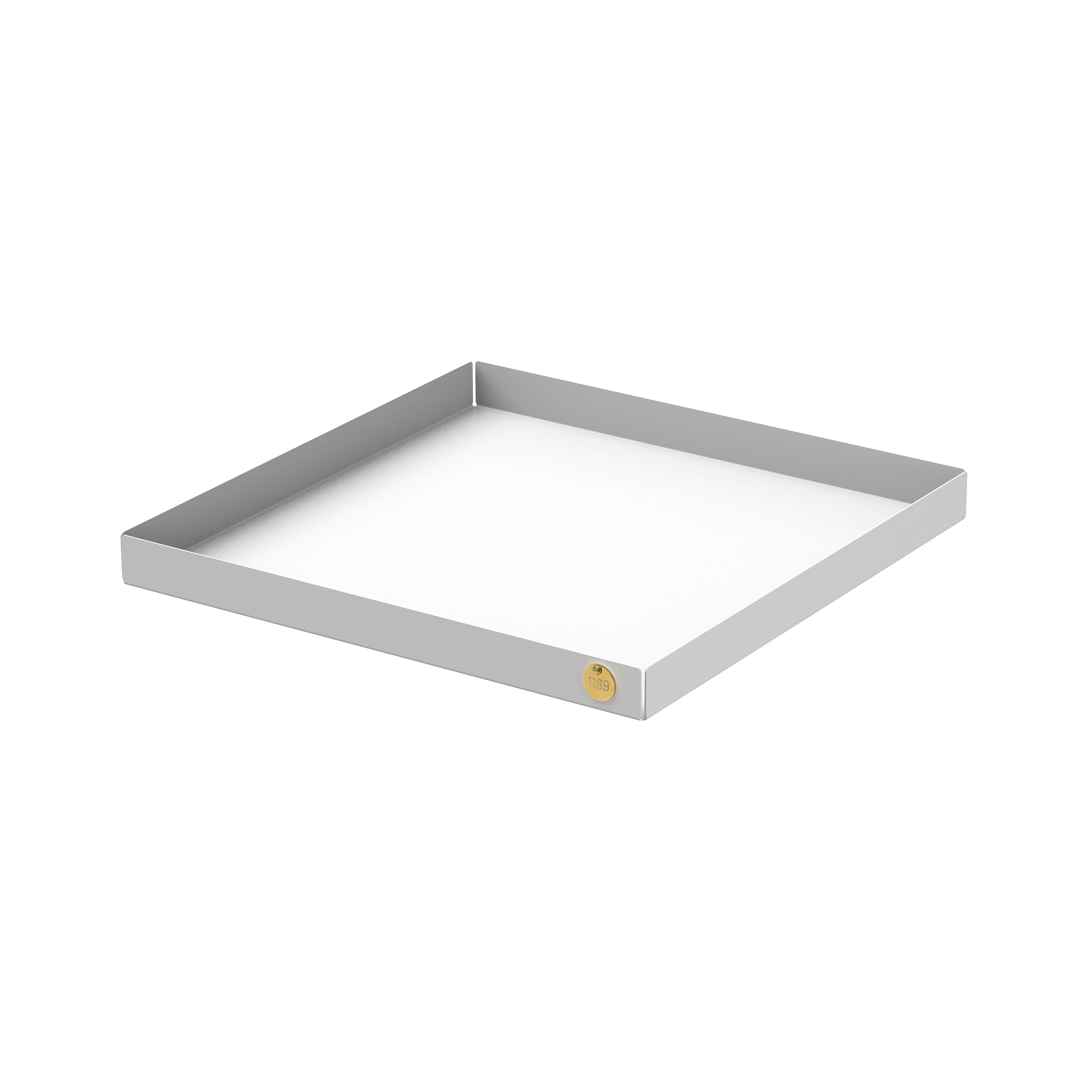 The Victor Foxtrot POI Tray XL is a square, shallow tray made from powder-coated steel. It has a gray exterior and white base, with a small round golden emblem in one corner. Set against a plain white background, this elegant piece is ideal for design enthusiasts.