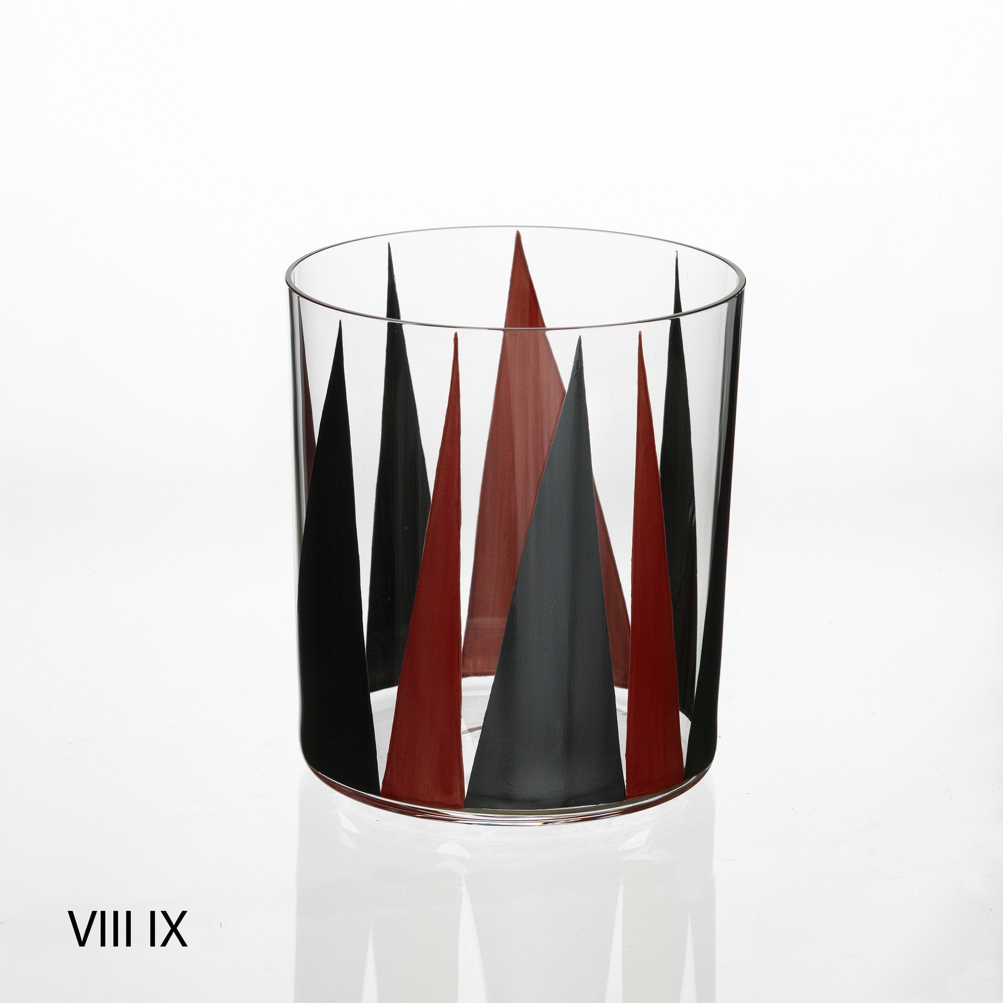 A clear glass features contemporary alternating black and brown triangular designs. Against a white background, it reflects Lobmeyrs elegant style. VIII IX is in the bottom left, hinting at Martino Gampers influence, part of the Neo Light VIII Enamel Collection by Lobmeyr.