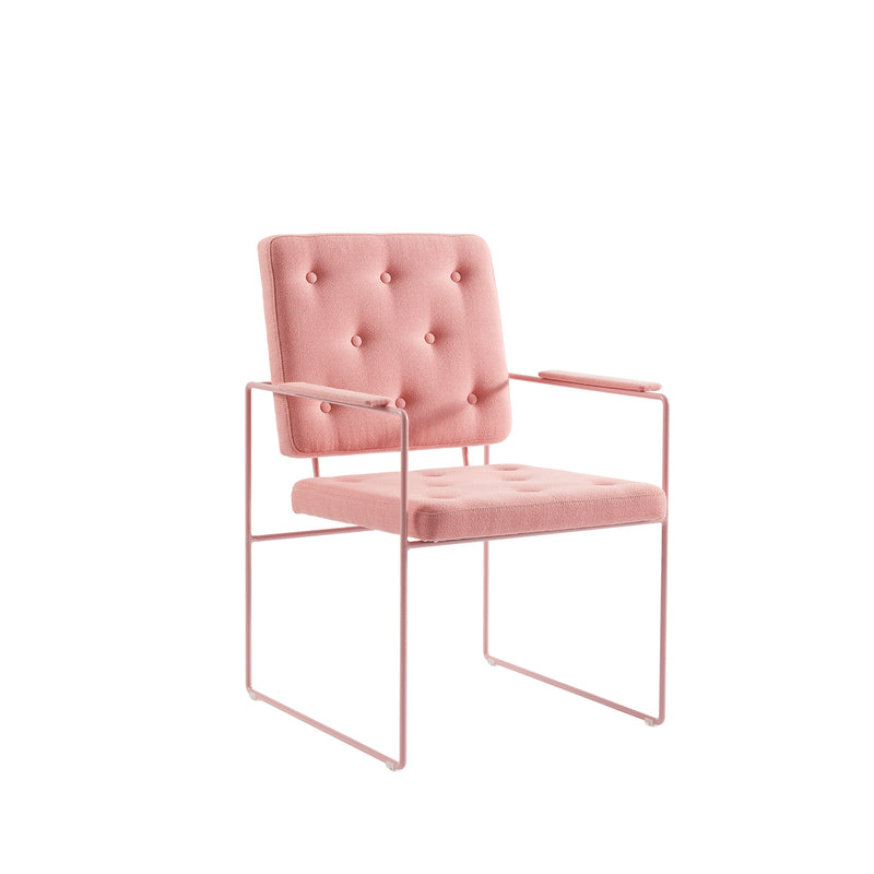 The SWELL TIME Dining Chair by Victor Foxtrot features elegant pink fabric on a tufted cushion and backrest with intricate button stitching, all resting on a sleek steel frame. The modern design stands out against a plain white background.