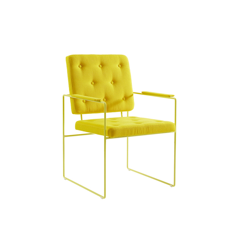 The Victor Foxtrot SWELL TIME Dining Chair is a yellow chair featuring a tufted cushioned seat with button stitching, a backrest, armrests, and a minimalist steel frame. It blends modern and vintage design elements, providing a vibrant yet stylish seating option against a plain white background.