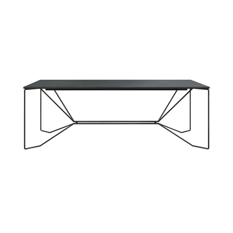 The SAME SAME Linoleum Table by Victor Foxtrot is a minimalist black rectangular dining table with a dark top and thin, powder-coated steel legs in a geometric design, connected by horizontal support bars for a sleek, modern look.