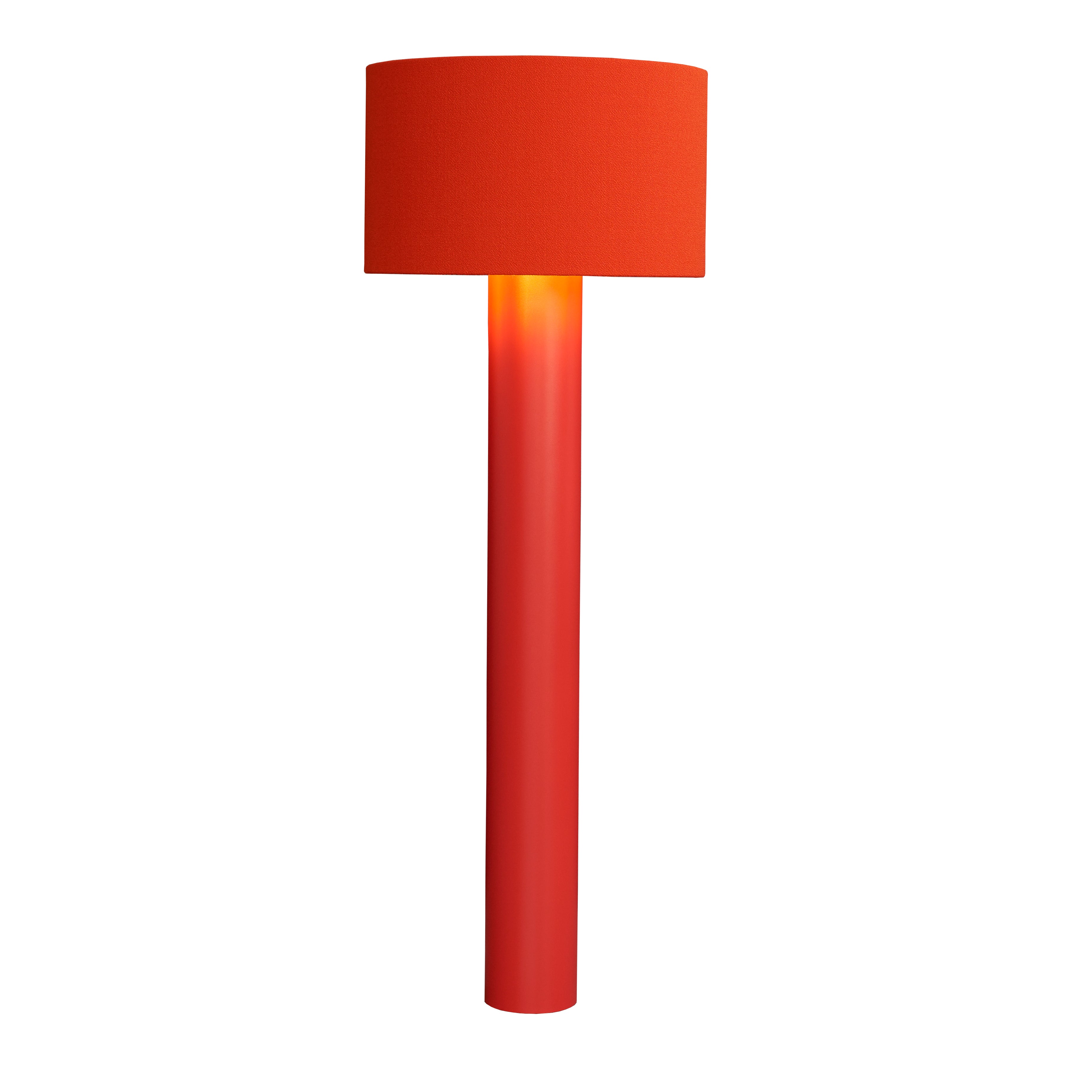The ALL ROUND Floor Lamp by Victor Foxtrot features a bright red wool fabric cylindrical base and shade. A warm yellow bulb glow is visible through the semi-transparent base, set against a plain white background.