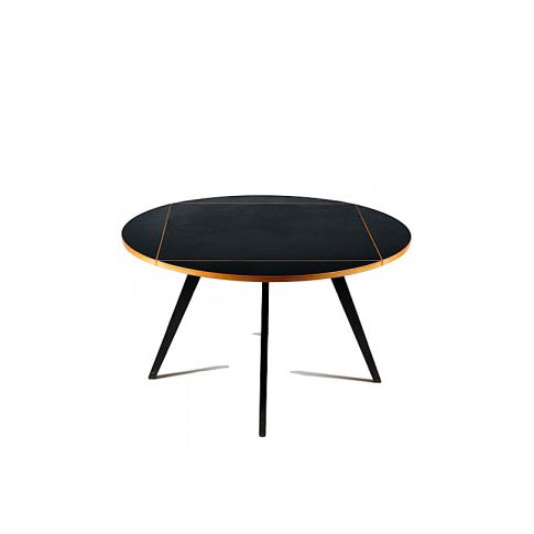 The Quadrat-Rund Table by WB Form combines modern design with a round black top, thin wooden edge, and three slender black legs, capturing Max Bills minimalist aesthetic and the contemporary elegance of Wohnbedarf Zurich.