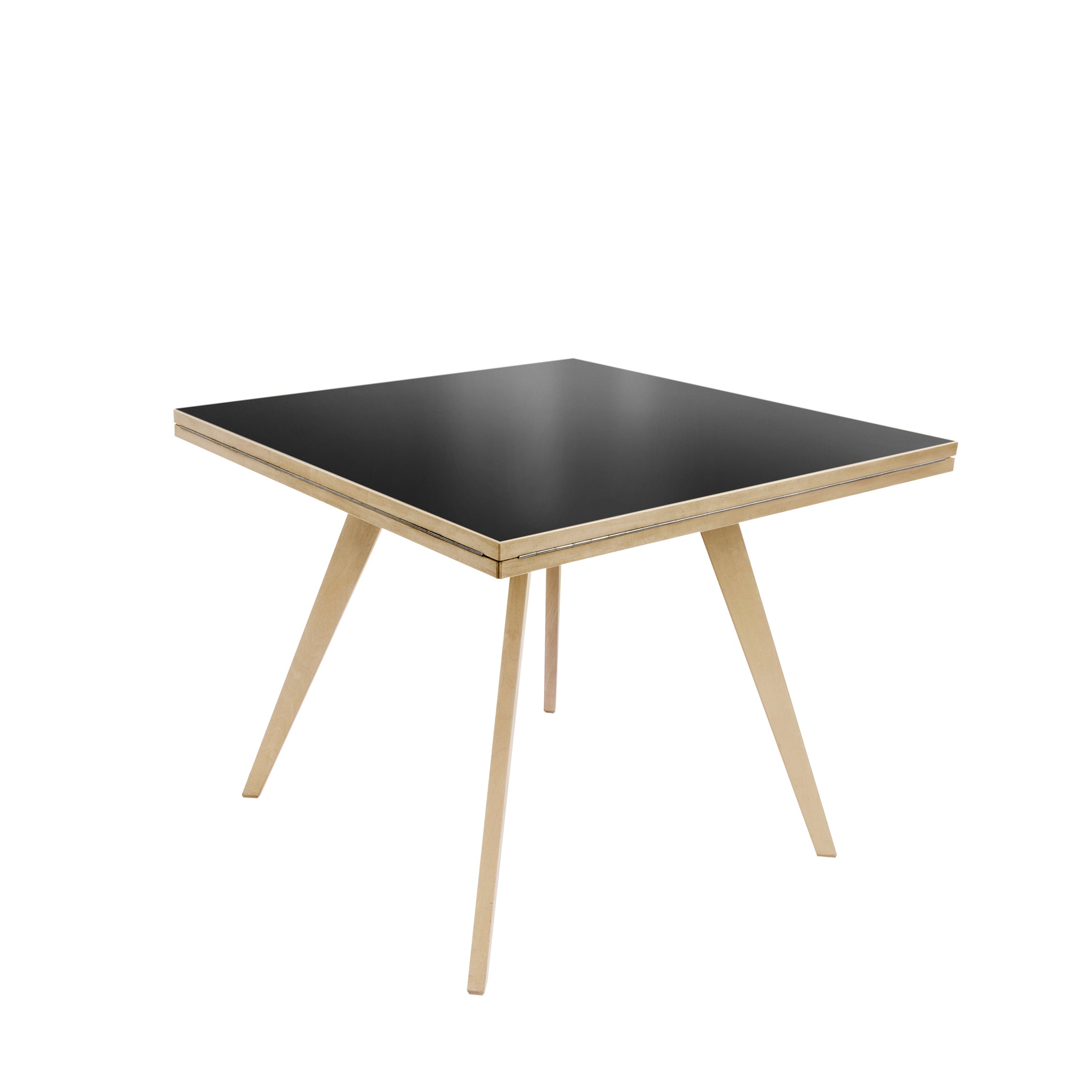 The Quadrat-Rund Table by WB Form, inspired by Max Bill design, features a sleek black top and outward-angled light wooden legs for stability. It complements contemporary interiors and echoes the iconic Wohnbedarf Zurich style.