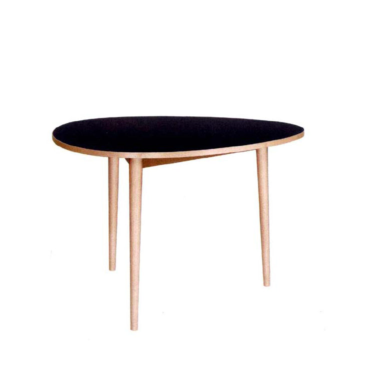 The Drei-Rund Dining Table by WB Form features a modern, black oval top with light wooden legs. Its minimalist design echoes Max Bills style, standing elegantly against a white background.