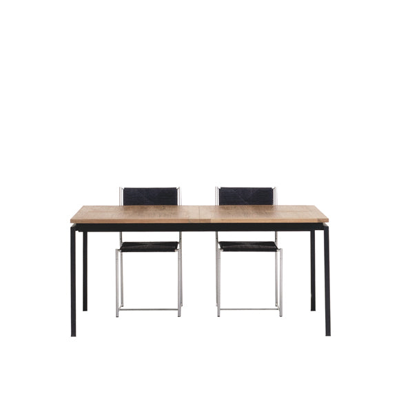 The UPW 1010 Extendable Table by WB Form exemplifies superior craftsmanship, featuring a minimalist rectangular wooden table with a black frame, paired with two matching chairs with black seats and metal legs. The elegant setup is set against a plain white background.