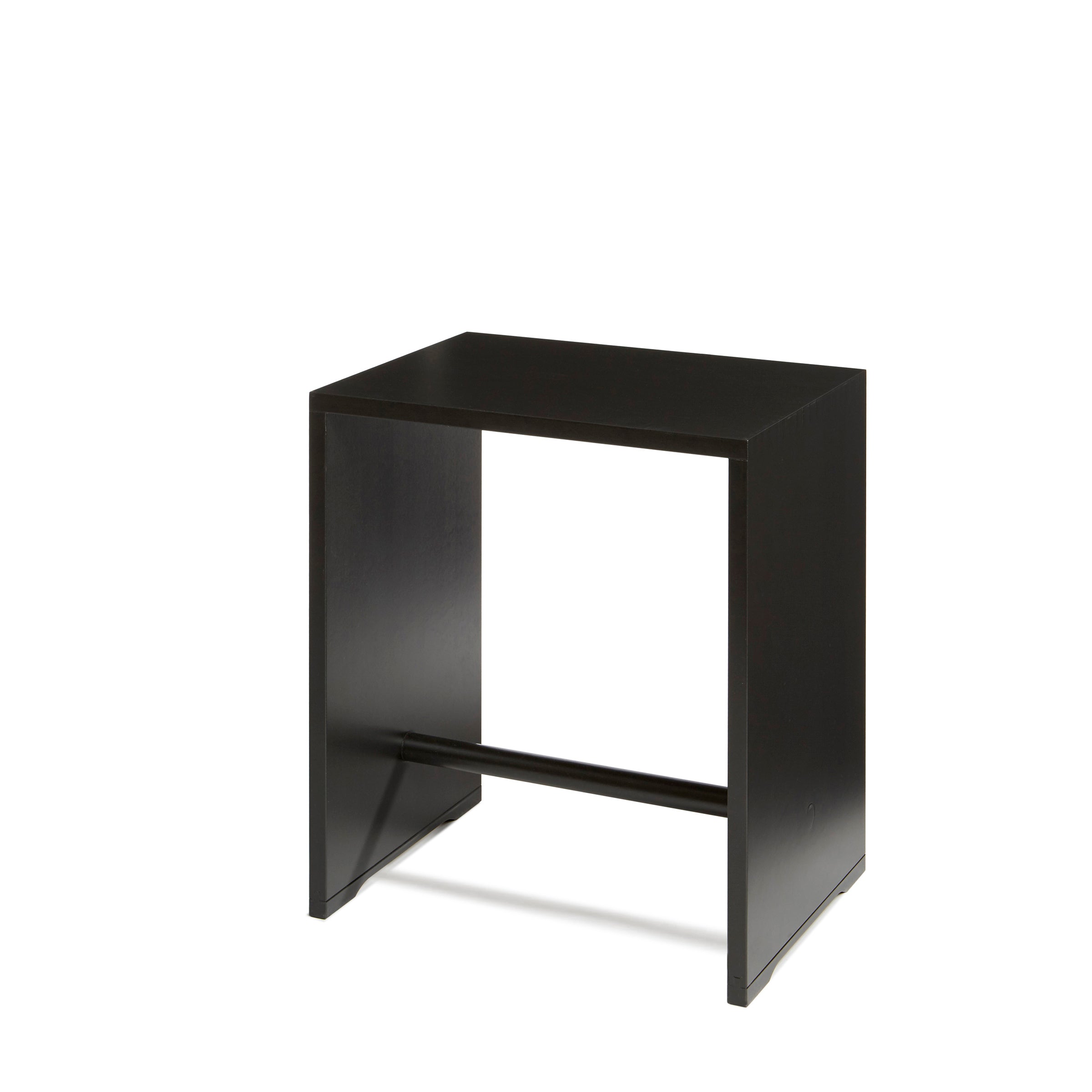The stylish Ulmer Stool by WB Form is a minimalist black wooden table with a rectangular top, two solid side panels, and a horizontal support bar underneath, offering versatile elegance against any space.