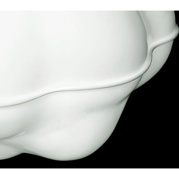 A close-up of a white ceramic piece with smooth curves, resembling an abstract sculpture or a pendant lamp from the WB Form Cloud Lamp collection, is set against a black background.