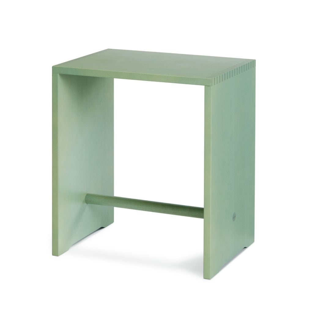 The Ulmer Stool by WB Form is a minimalist, rectangular, mint green side table inspired by the Max Bill design. Its open space between vertical legs adds functionality and versatility akin to a stool, and it comes in nine finishes for customized aesthetics.