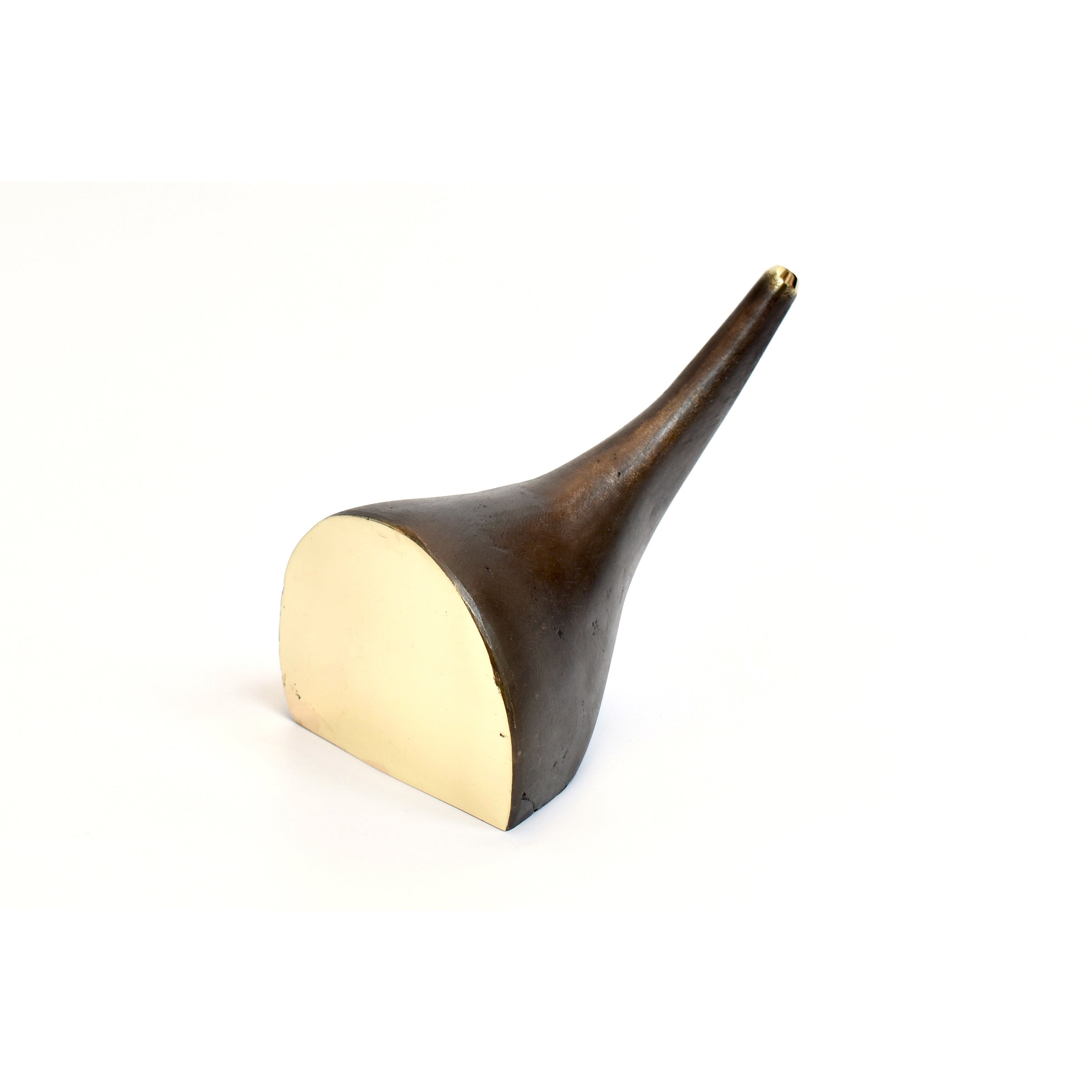 The Vase Elephant #3790 by Werkstätte Carl Auböck is a bronze horn-shaped sculpture with a polished surface and a circular base in white. Its tapered design embodies the elegant Wiener Bronzen tradition, reminiscent of Carl Auböcks aesthetic against a plain background.