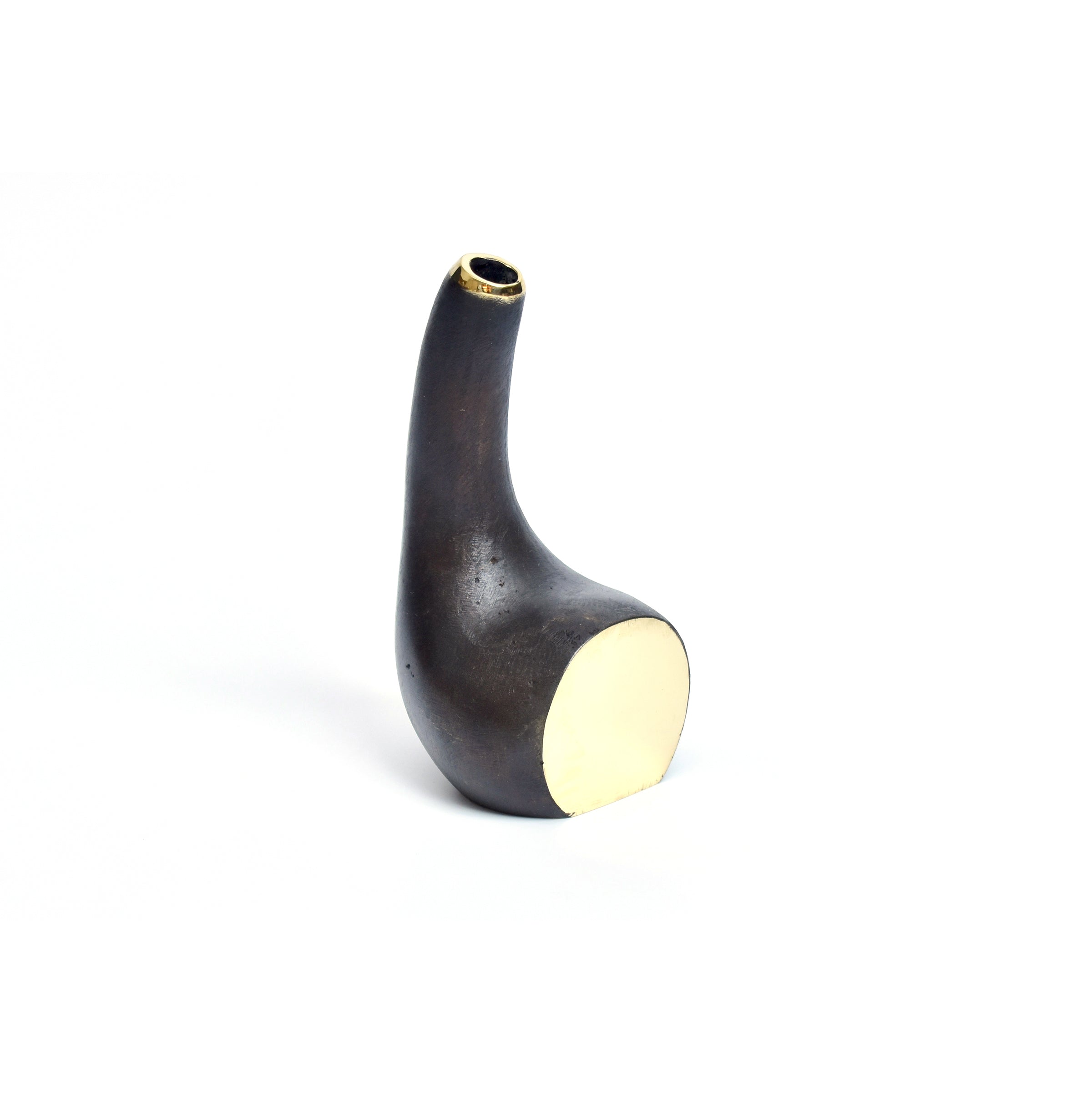 Against a white background, Vase Gourd #3793 by Werkstätte Carl Auböck is a dark, uniquely shaped ceramic with a tall curved form, smooth surface, small top opening, and circular cream-colored bottom, reminiscent of Viennese townhouse elegance.