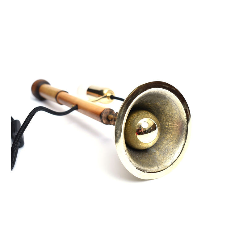 The Table Lamp Bell #3875 by Werkstätte Carl Auböck features a copper and brass design on a white background, reminiscent of an elegant Viennese townhouse. Its shiny brass bell is showcased prominently with a black cord attached.