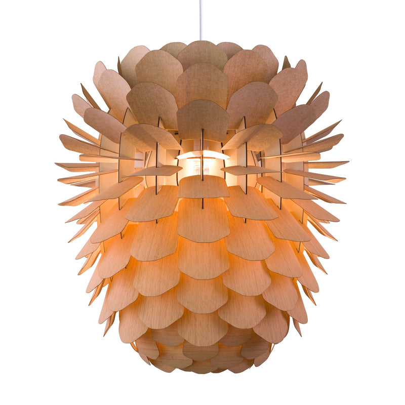 The Zappy Oak by Schneid is a handmade pendant lamp with a design resembling overlapping wooden leaves in ash or oak veneer. It emits a warm glow, providing an organic, sculptural appearance with layered texture.