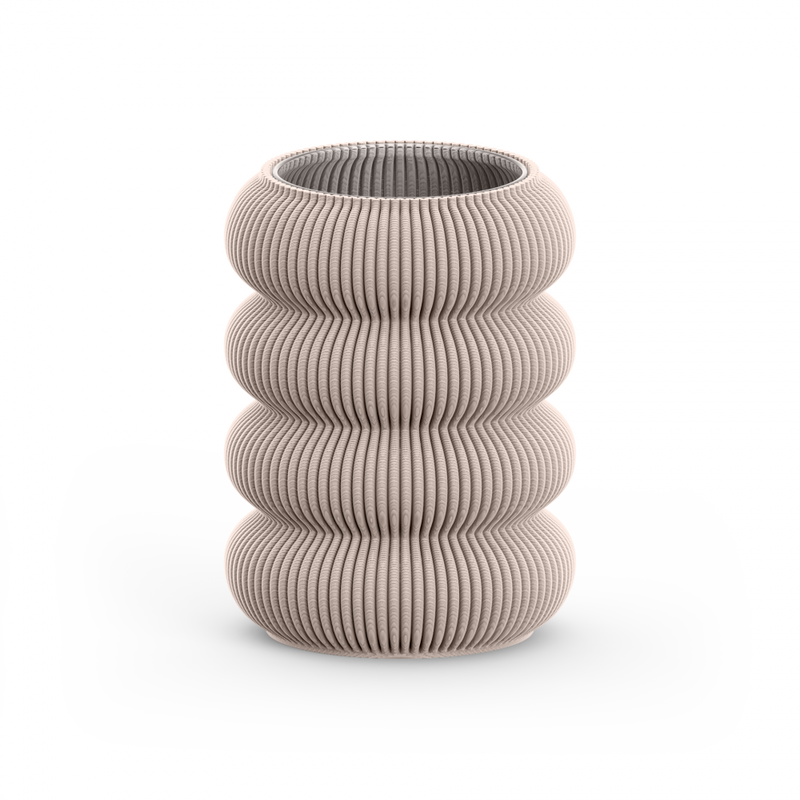 A beige ribbed vase with four vertical rounded sections, resembling pillars or piled cushions, from Sheyns Zayl 130g collection, shown on a white background.