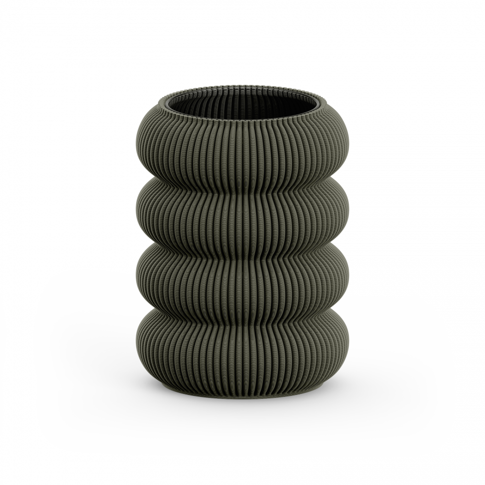 The Sheyn Zayl 130g Vase is a dark gray, vertically ribbed, cylindrical piece resembling architectural pillars. Its stacked, rounded design is crafted through 3D printing into four segmented sections and sits elegantly on a flat white surface.