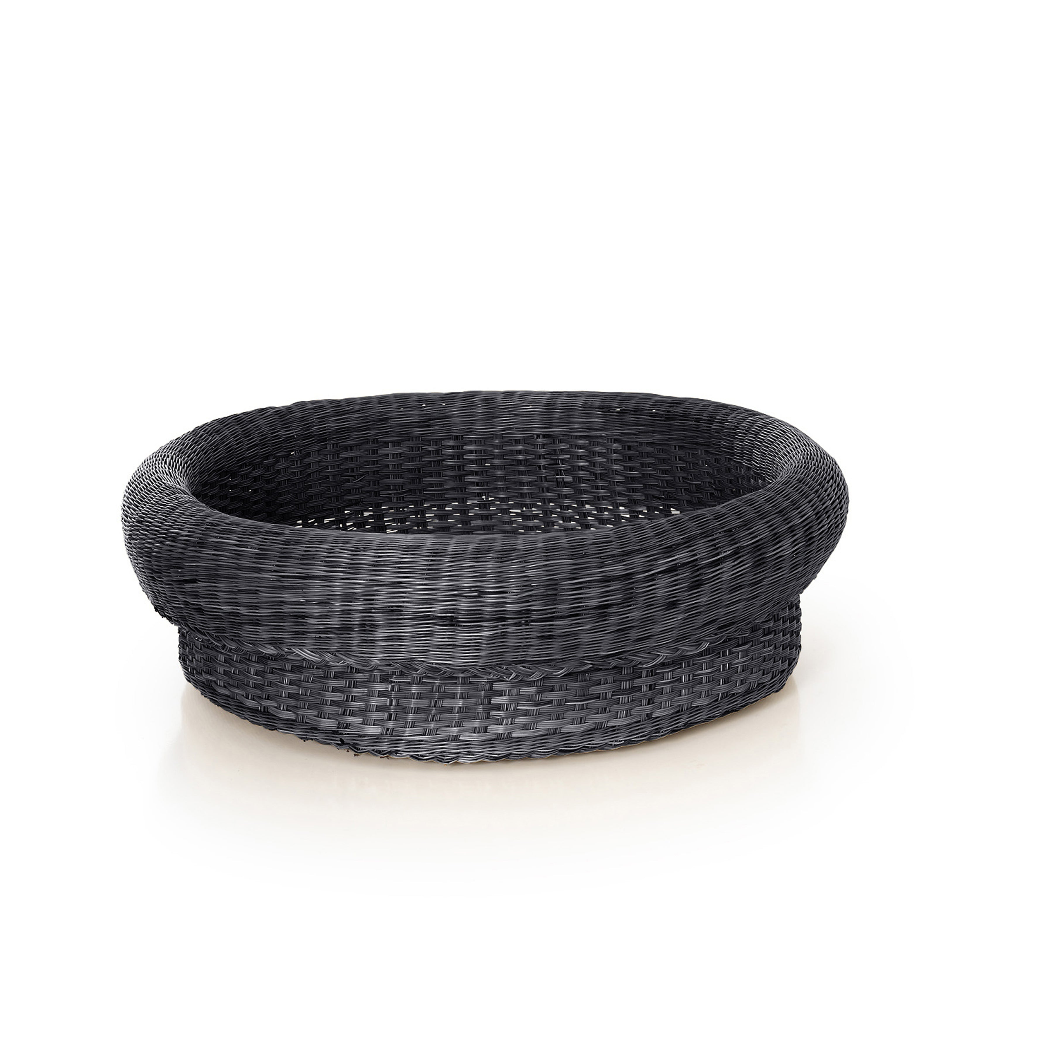 The Ames Fibra Basket Large by Ames is a round, black woven basket handcrafted in Colombia. Displayed empty against a white background, it features a thick rim and intricate interior texture.