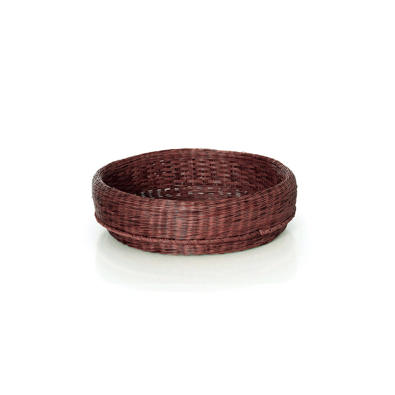 The Ames Fibra Basket by Ames is a round, shallow wicker basket handcrafted in Colombia from esparto grass with a dark brown finish, shown empty on a white background.