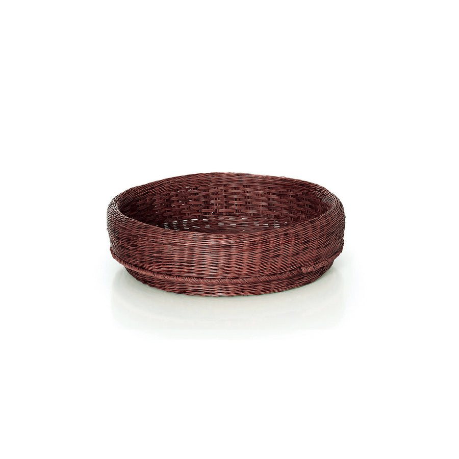 The Ames Fibra Basket by Ames is a round, shallow wicker basket handcrafted in Colombia from esparto grass with a dark brown finish, shown empty on a white background.