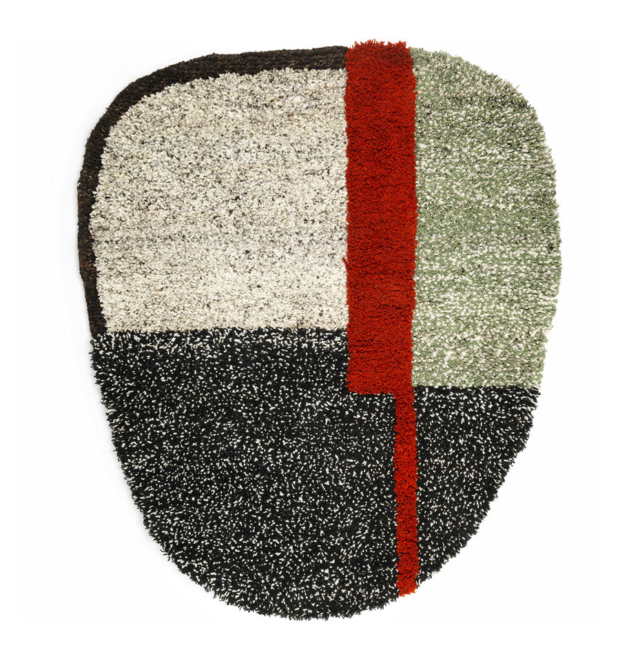 Explore Colombian craftsmanship with Ames Nudo Rug, featuring an abstract textured design. It includes quadrants in black, white, gray, and green tones accented by a bold vertical red stripe slightly off-center for a modern artistic flair.