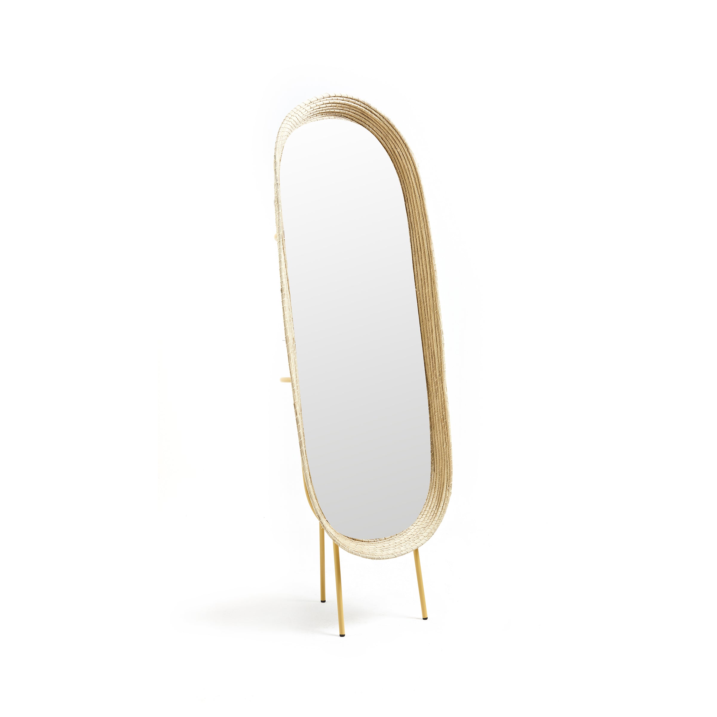 The Ames Killa Standing Mirror by Ames features an oval, full-length design with a light iraca palm woven frame and sleek gold legs, displayed against a plain white background.