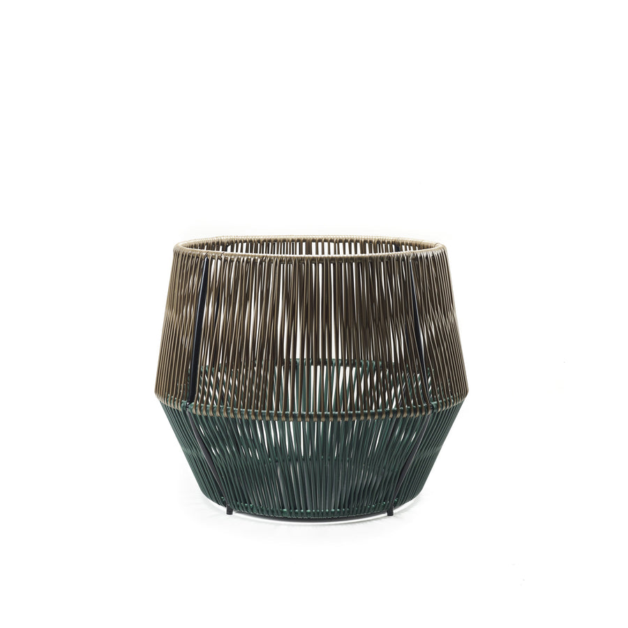 The Caribe Chic Basket 2 by Ames features a modern design with two-toned vertical bars in brown and green. Using the mamposino braiding technique, it has an open-weave structure that creates a rounded, geometric look on a plain white background.