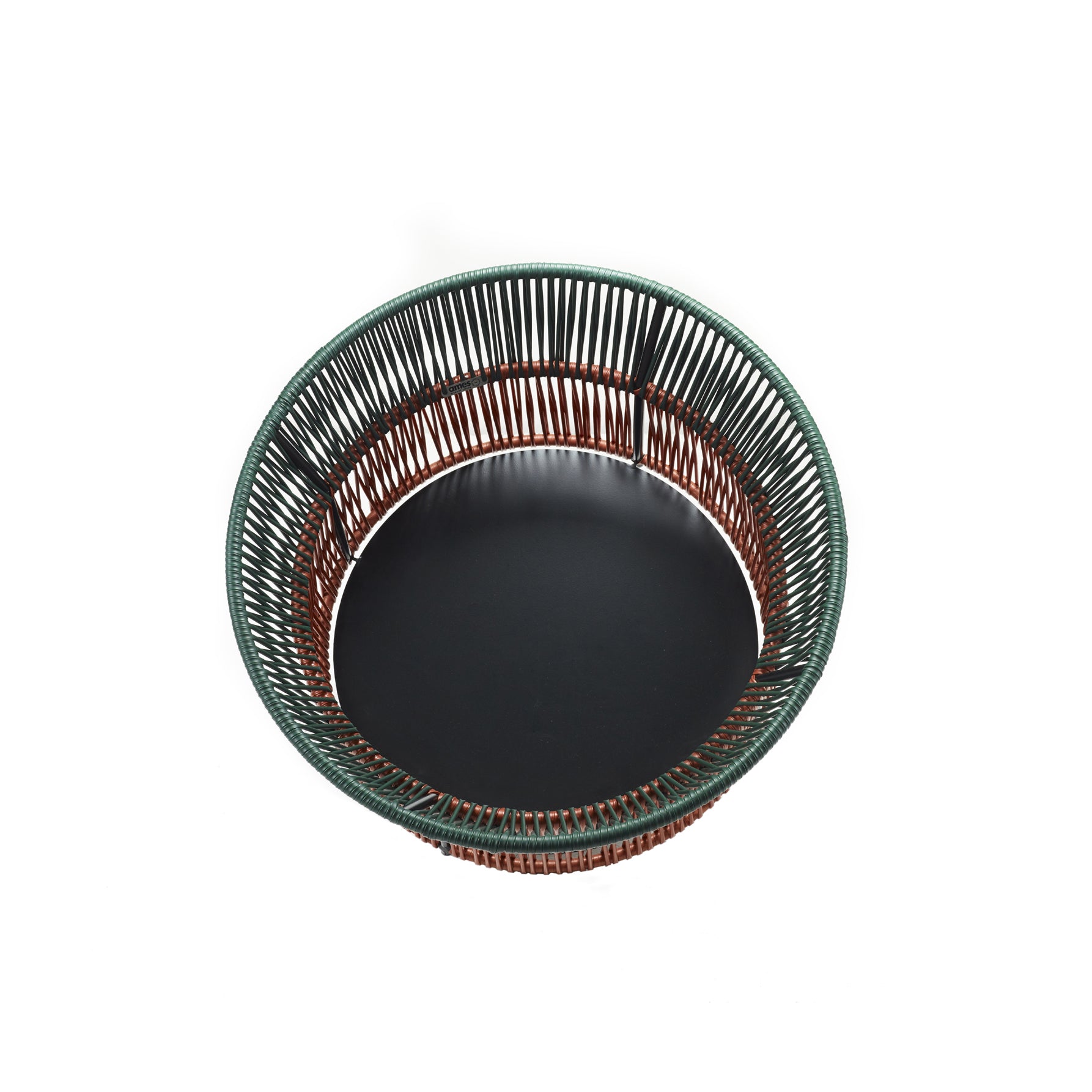 An overhead shot highlights the open-sided Caribe Chic Basket 3 by Ames, showcasing expert traditional braiding with thin wires. Its design features a dark brown base and a green rim, offering an attractive contrast.