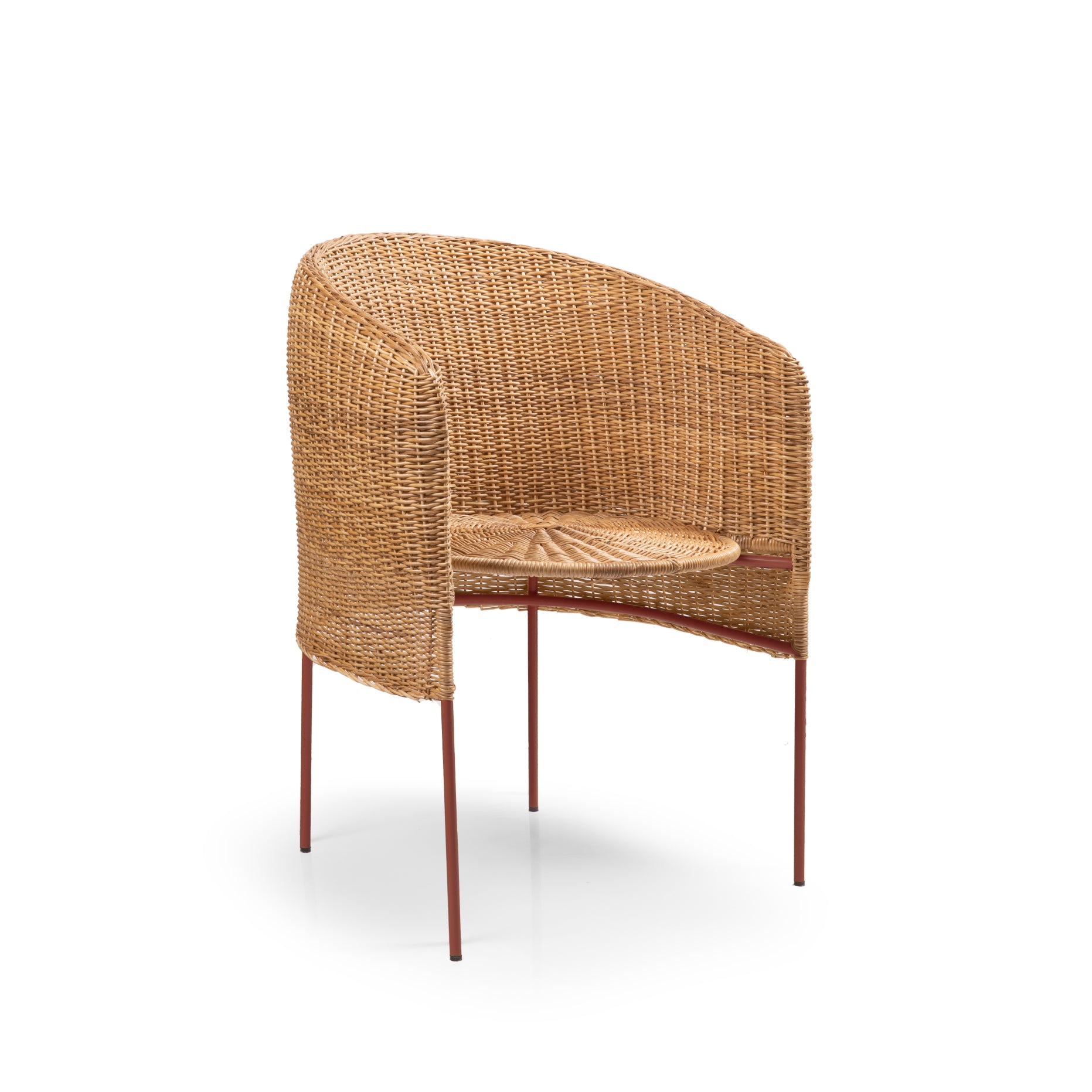The Ames Caribe Natural Dining Chair by Ames features a rounded backrest and seat of woven rattan that showcases Colombian craftsmanship, supported by four slim metal legs with a reddish-brown finish, shown on a white background.