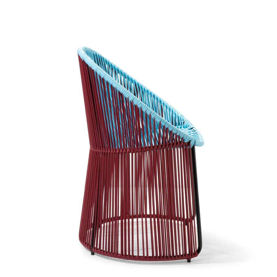 The Ames Cartagenas Dining Chair by Ames features a circular base, open sides, vertical red rods for the frame, and a woven light blue seat and backrest for a minimalistic, contemporary look.