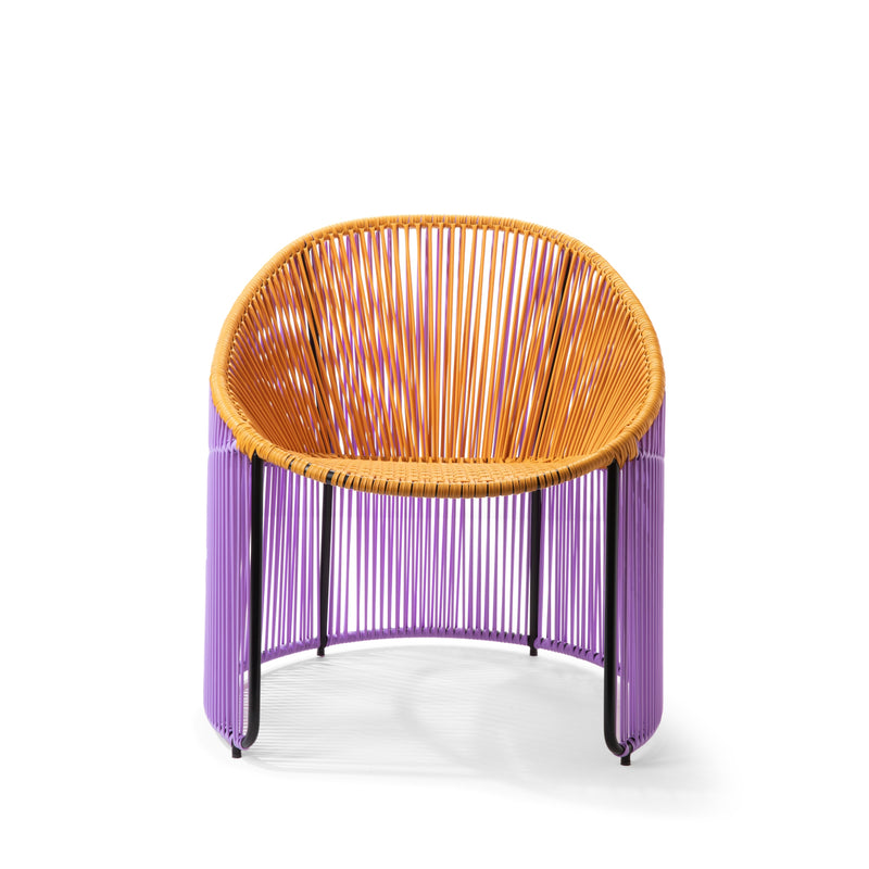 The Ames Cartagenas Lounge Chair, part of the vibrant seating collection, features a colorful design with an orange woven seat and purple legs. Its circular shape is supported by a sturdy black metal frame, combining style and functionality.