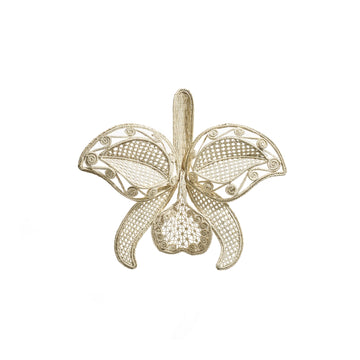 The Ames Cattleia Wall Decor by Ames features a delicate gold filigree design shaped like a Cattleya orchid, with intricate patterns and fine wirework on its petals and center, presented on a plain white background.