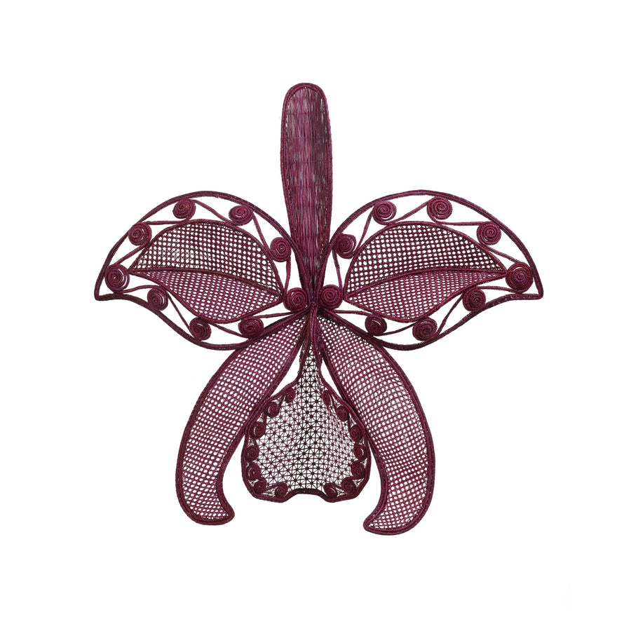 The Ames Cattleia Wall Decor by Ames features a detailed purple wire sculpture of a Cattleya orchid, showcasing swirling and netted petal patterns. Perfect as handmade wall art, it stands out against a white background.