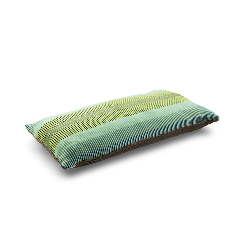 From Ames Chumbes Layer collection, this rectangular pillow features a gradient design with green and blue stripes on a plain white background, reflecting traditional textile symbols.