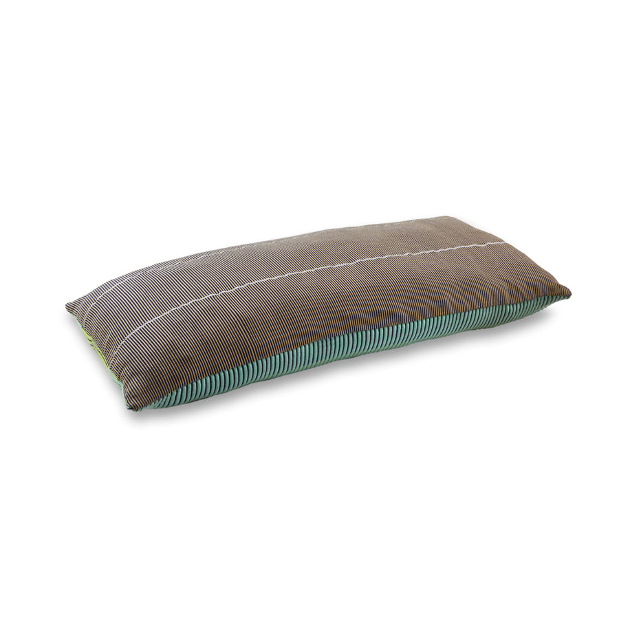 From the Chumbe collection by Ames, the Chumbes Layer is a long, rectangular pillow with hand-woven charm, featuring gray and brown stripes. Its green bordered bottom enhances its textured fabric, making it a standout among hand-woven cushions.