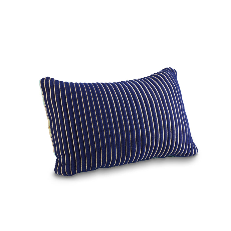 The Ames Chumbes Cushions by Ames feature a rectangular design in deep blue with vertical white pinstripes, inspired by Mae Engelgeer’s hand-woven style. Shown on a plain white background, it brings a modern touch to any space.