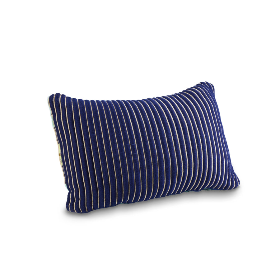 The Ames Chumbes Cushions by Ames feature a rectangular design in deep blue with vertical white pinstripes, inspired by Mae Engelgeer’s hand-woven style. Shown on a plain white background, it brings a modern touch to any space.