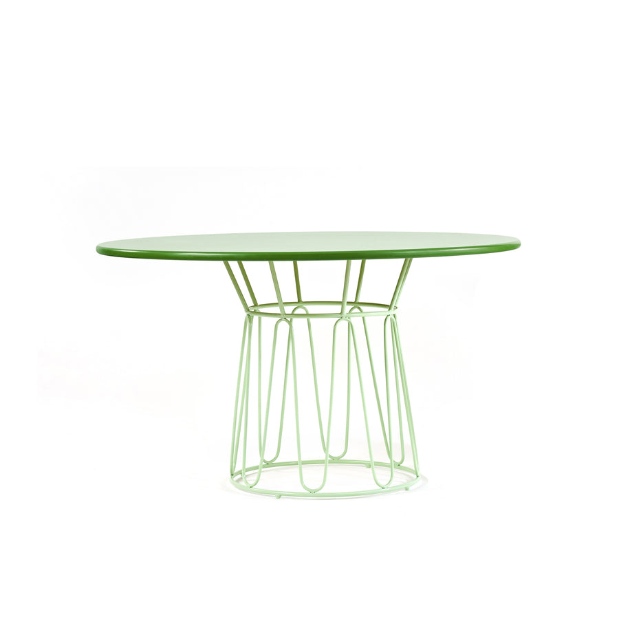 The Ames Circo Dining Table by Ames features a green top and geometric open metal base in matching green, designed for indoor use, shown against a plain white background.