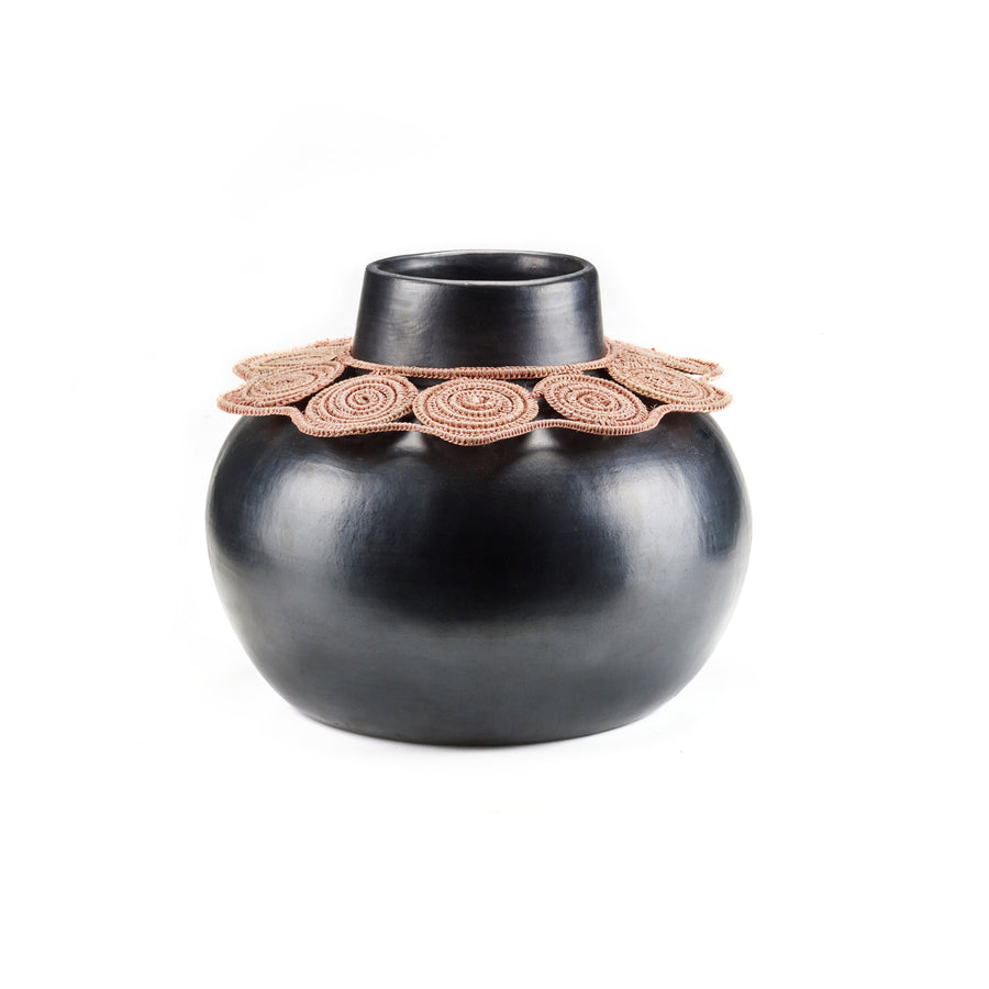 The Ames Coyar Vase 1 by Ames is a glossy black ceramic vase with a wide round body, narrow neck, and coiled tan wickerwork patterns near the opening—an elegant example of Coyar vases.