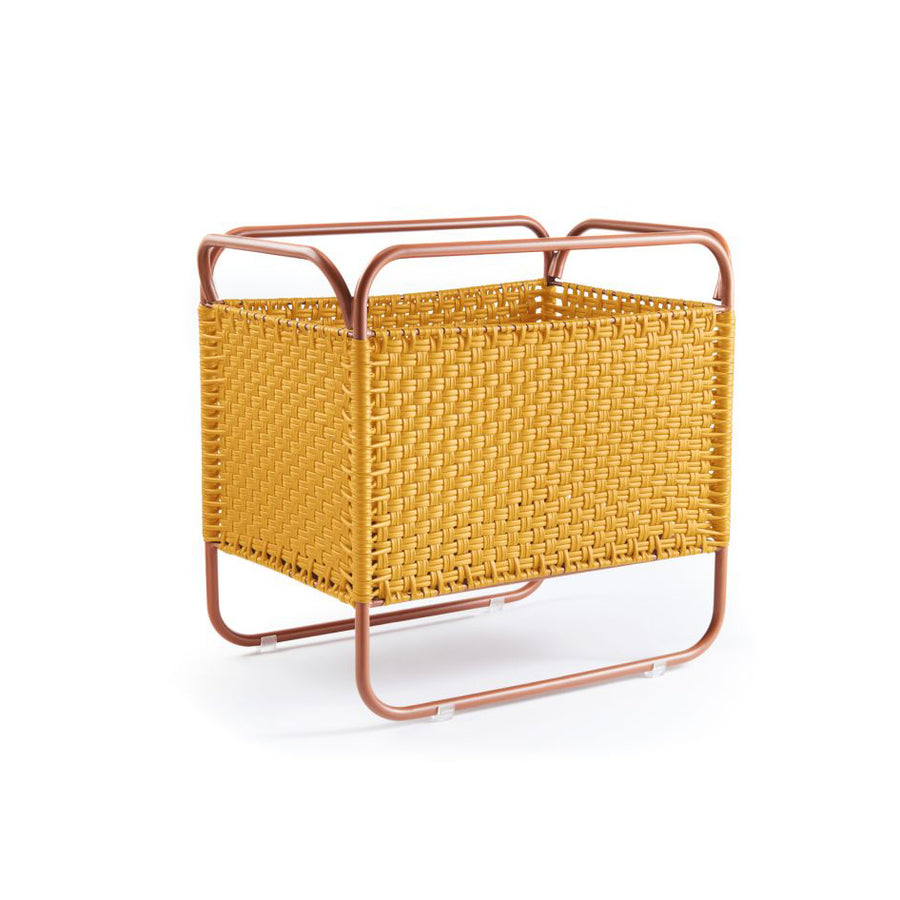 The Ames Dichas Natural Basket 1 by Ames is a rectangular yellow woven storage basket with an open top, supported by a pinkish metal frame with rounded edges. Perfect for organizing essentials or pairing with side tables as stylish recycled plastic furniture.