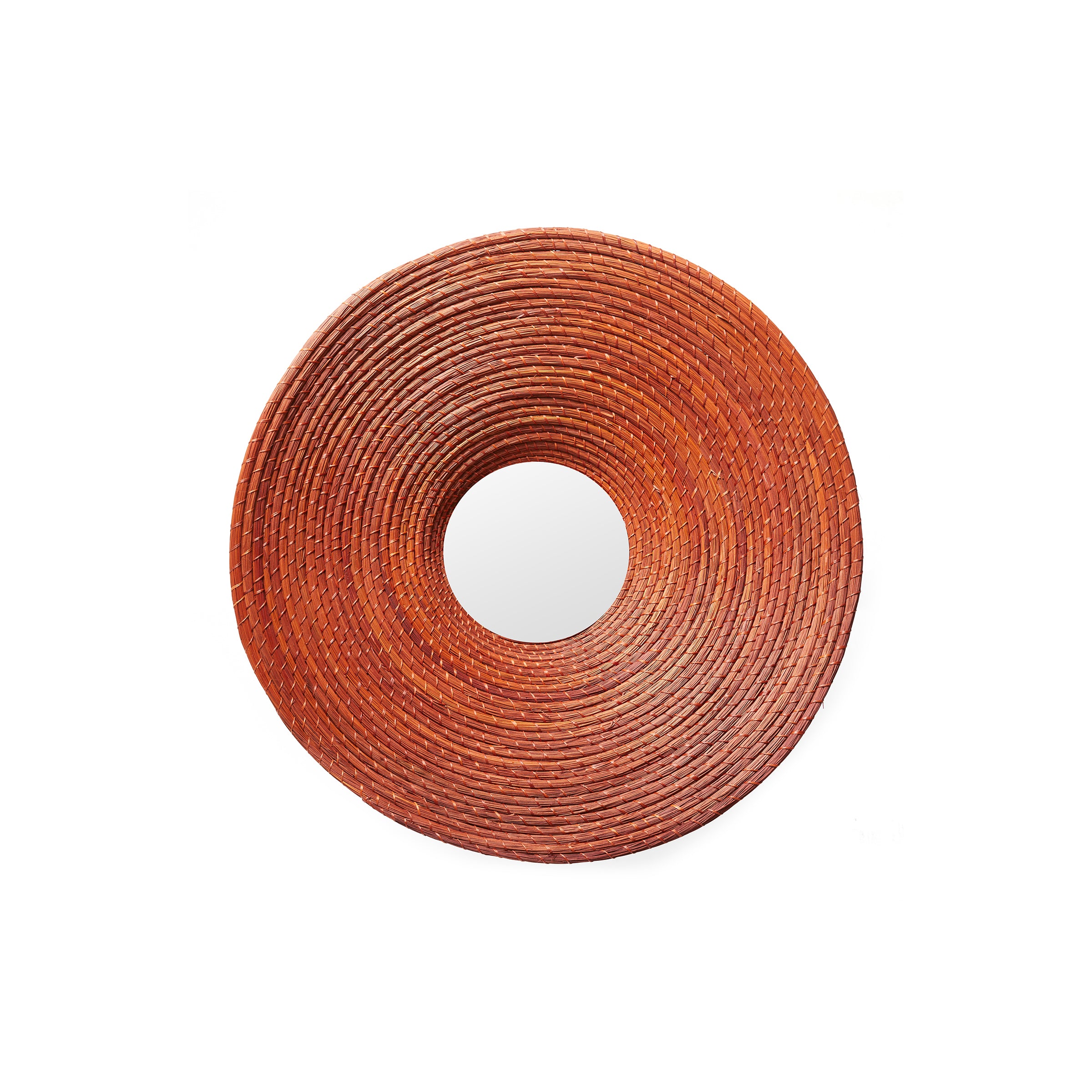 The Ames Killa Mirror by Ames features a round design with a thick, textured, reddish-brown woven frame that resembles coiled Iraca palm rope, shown against a white background.