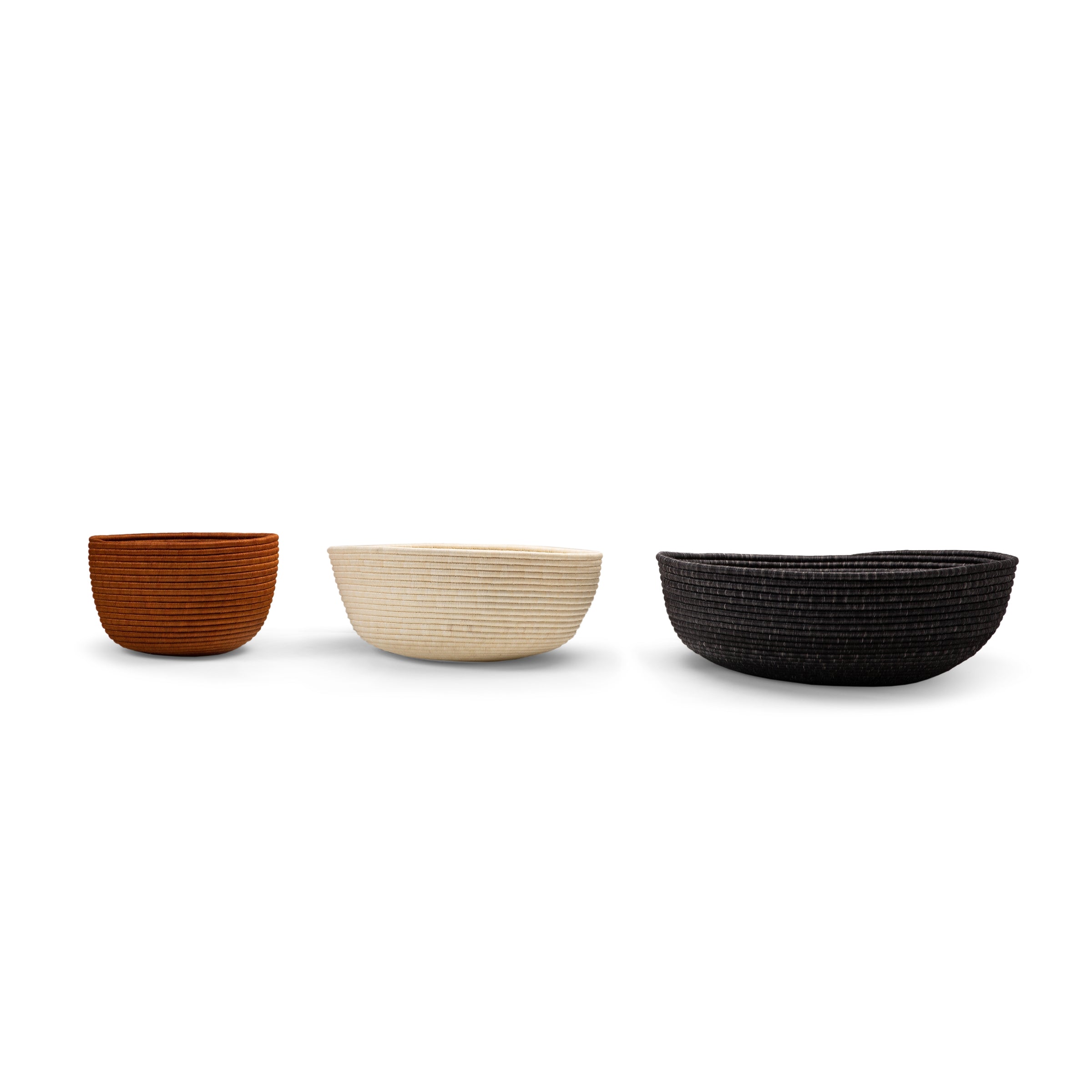 Three Ames La Che Baskets by Ames—small brown, medium white, and large black—are displayed in a row against a white background.
